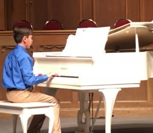Boy Performing in Piano Recital